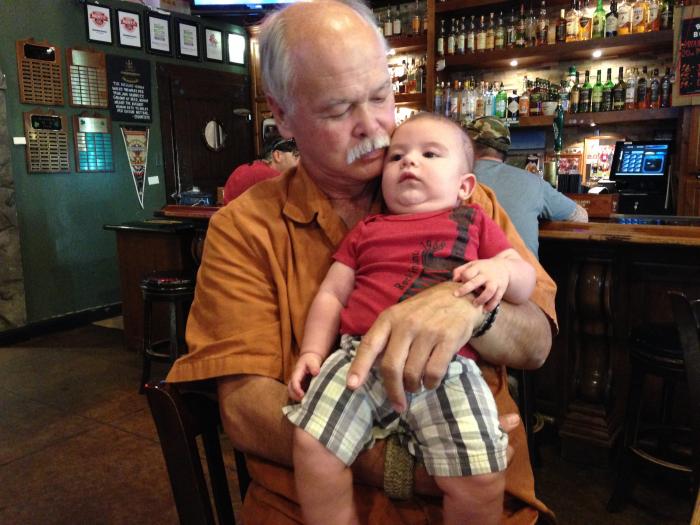 Huk holding my little boy at a bar in Redding!